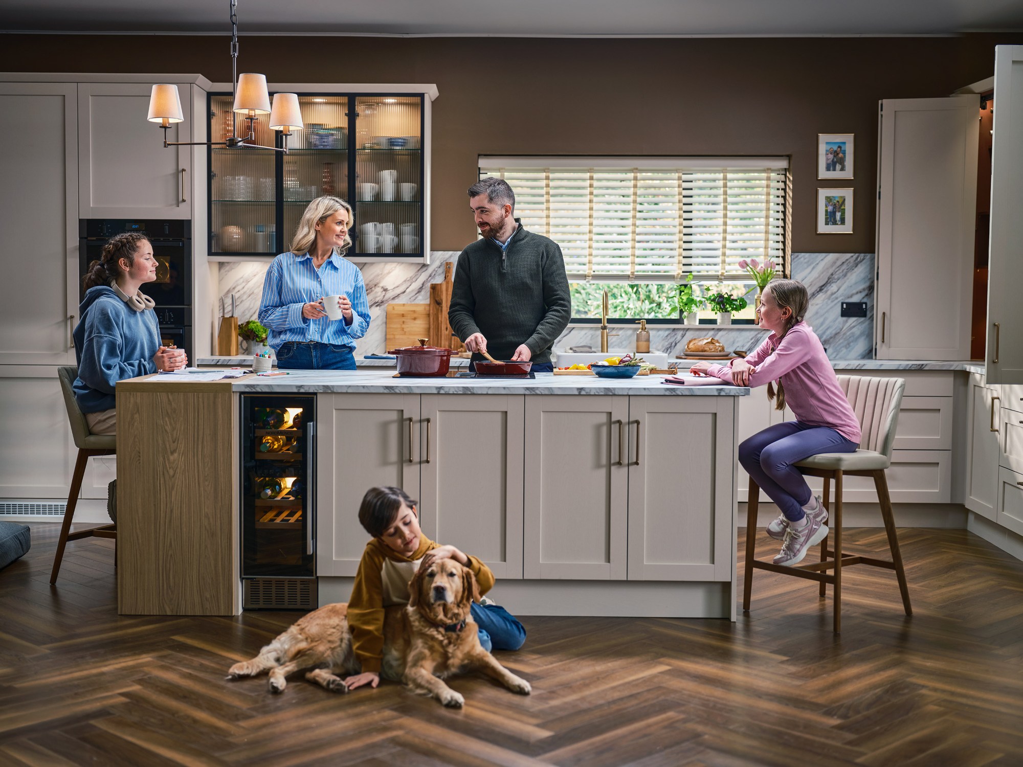 A family at home in a beautiful kitchen