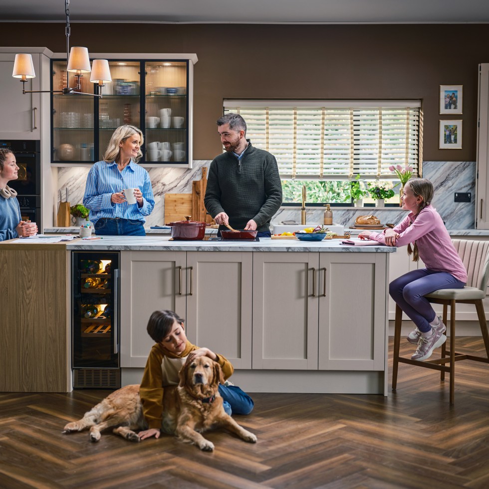A family at home in a beautiful kitchen